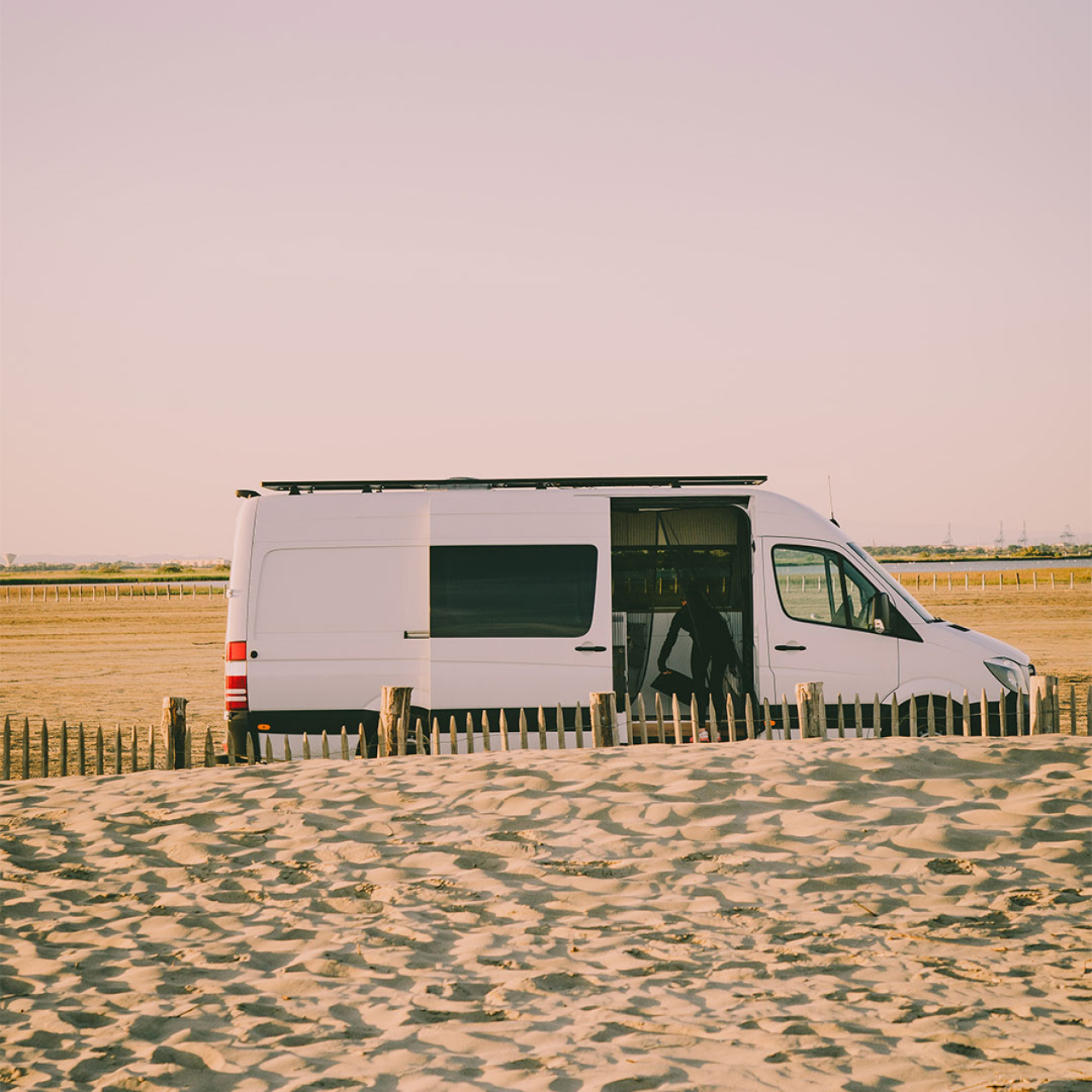 White van at the beach